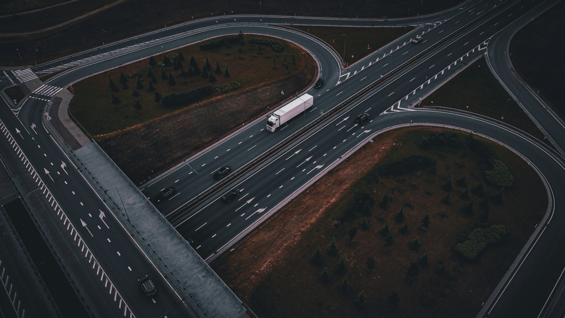 Freight truck travelling through an Ontario forest corridor